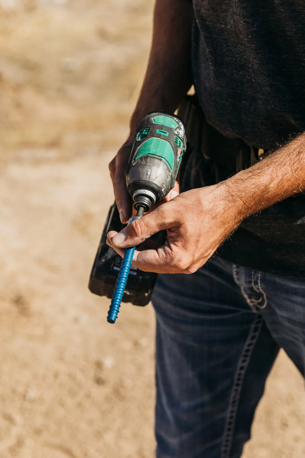 Guy holding drill